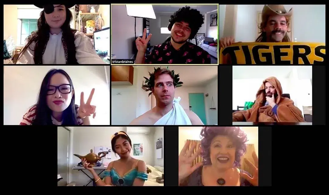 Friends in costumes posing on a video call during a themed virtual party